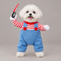 White dog wearing striped shirt and overalls doll costume with plush knife