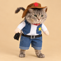 Pet wearing stand-up cowboy costume with hat and sheriff star